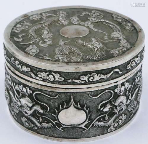 A Chinese export silver circular box and cover, profusely de...