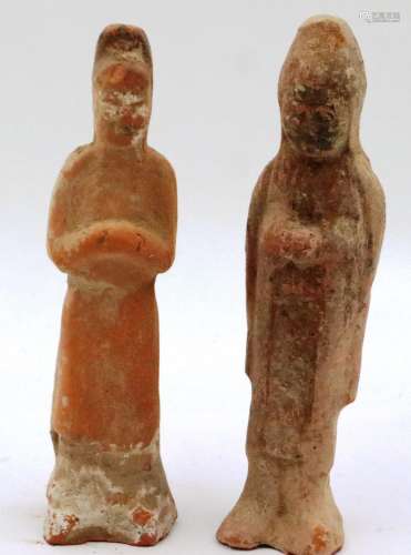 Two Tang Dynasty terracotta guardians, each of a standing pr...