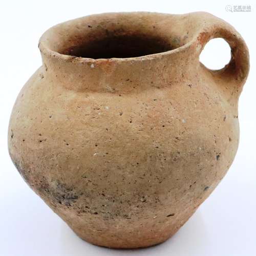 A small Han Dynasty vessel, having single handle, globular b...