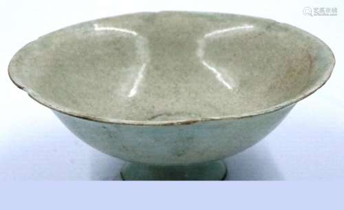 A Ming Dynasty glazed bowl, having a shaped rim and flared f...