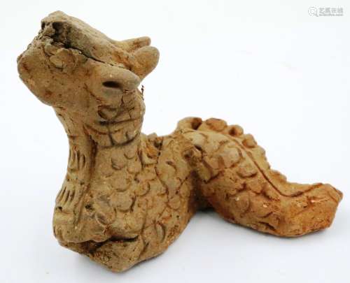 A Ming dynasty zoomorphic clay serpent or dragon ornament, i...