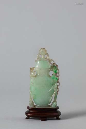 An apple green jadeite vase with cover. China, late Qing dyn...