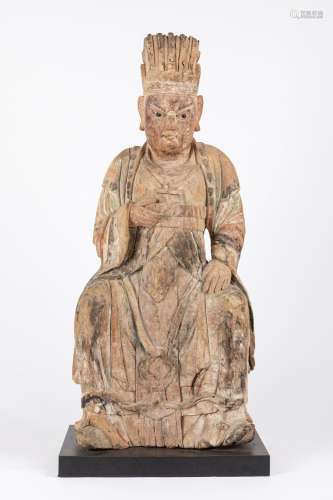 A large carved wood seated figure. China, late Ming dynasty