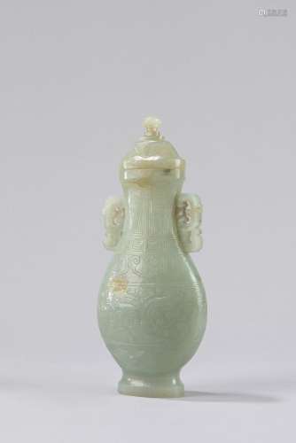 A celadon jade vase with cover. China, 19th century