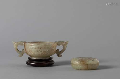 A small cup with handles and a carved celadon jade small box...