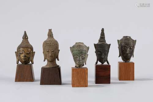 Five small bronze Buddha's head. Thailand end of 18th centur...