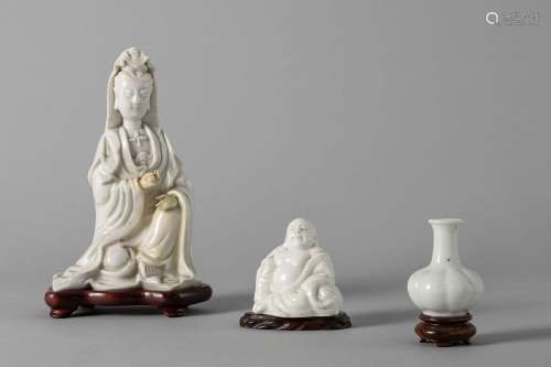 A blanc de chine porcelain Guanyin, one Budai, and a small v...