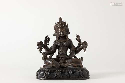 A dark patina bronze Vasudhara. Tibet, 19th century