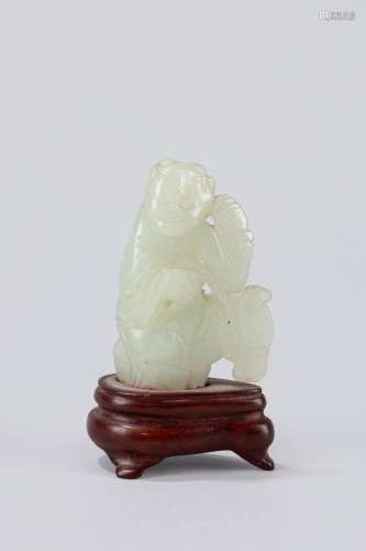 Small white jade carving of a child with a horse. China, lat...