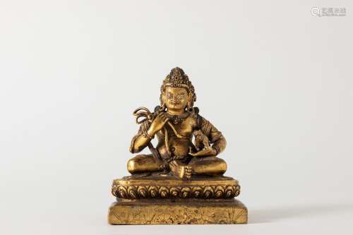 A gilt bronze Jambhala. Tibet, 18th century