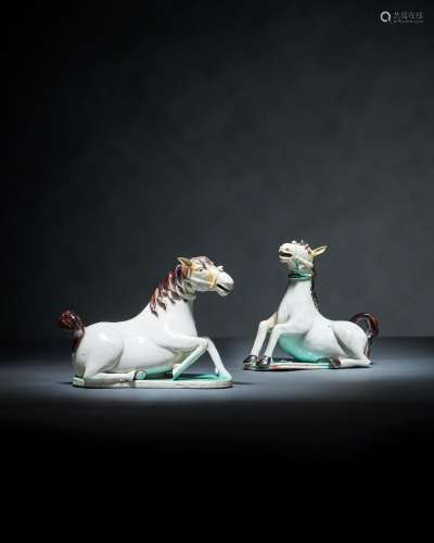 A rare pair of Chinese white glazed figures of horse water d...