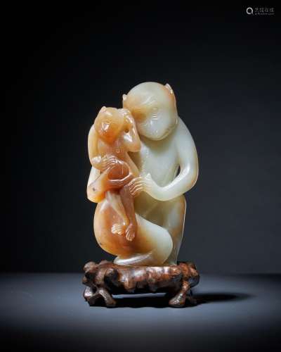 A rare Chinese pale celadon and brown jade model of a 'monke...