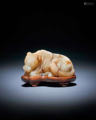 A Chinese white and russet jade model of a horse