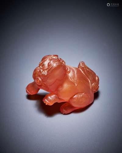 A Chinese amber carving of a lion