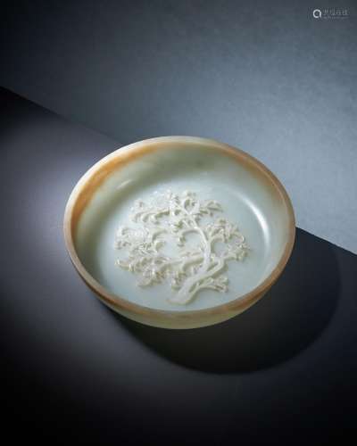 A Chinese pale celadon and brown jade shallow bowl