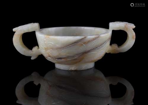 A Chinese white and russet jade archaistic cup