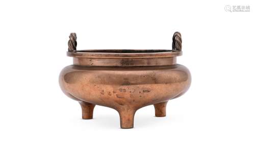 A large Chinese bronze twin-handled tripod censer