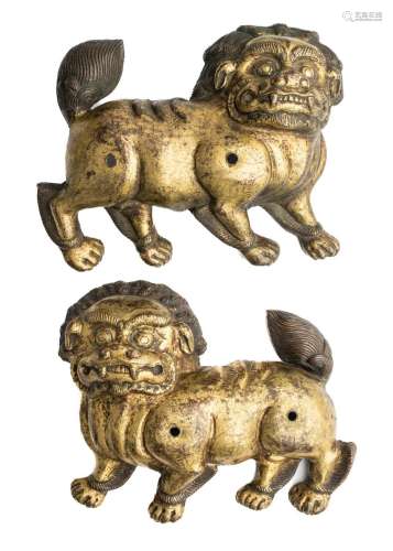 A PAIR OF COPPER-GILT RELIEFS OF LIONS