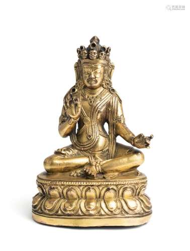 A SINO-TIBETAN GILT BRONZE FIGURE OF A MAHASIDDHA