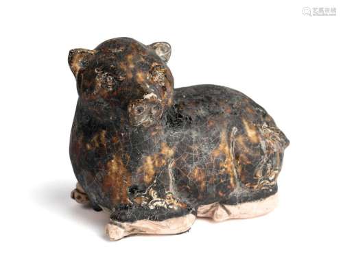 A KHMER BROWN GLAZED FIGURE OF A PIG