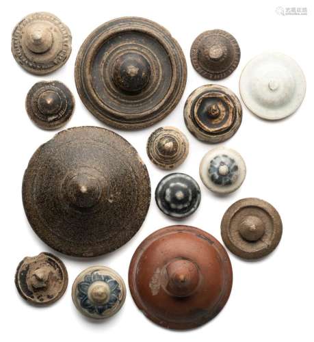 A GROUP OF FOURTEEN SOUTH-EAST ASIAN POTTERY LIDS