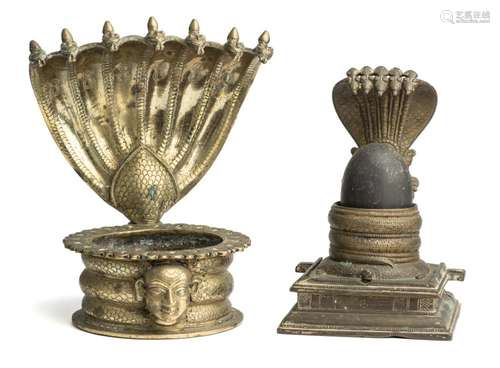 TWO BRASS LINGAM HOLDERS