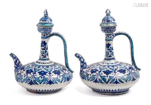 A PAIR OF BOMBAY SCHOOL OF ART ORNAMENTAL EWERS