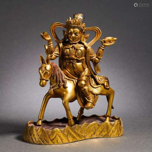 A Tibetan Bronze Gilt Jambhala