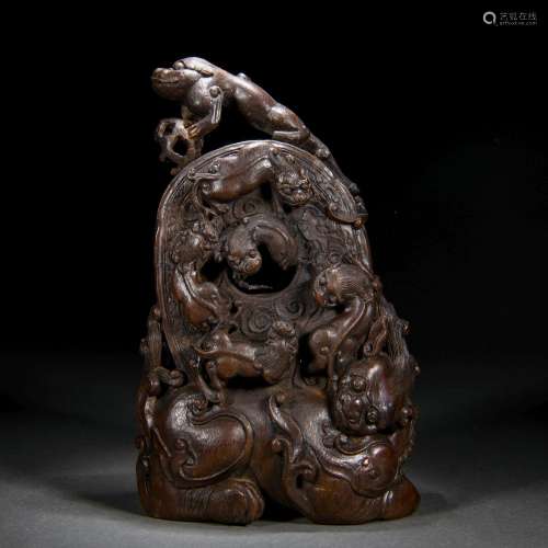 A Chinese Carved Aloeswood Beast Decoration
