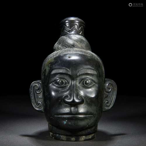 A Chinese Bronze Humanoid Head