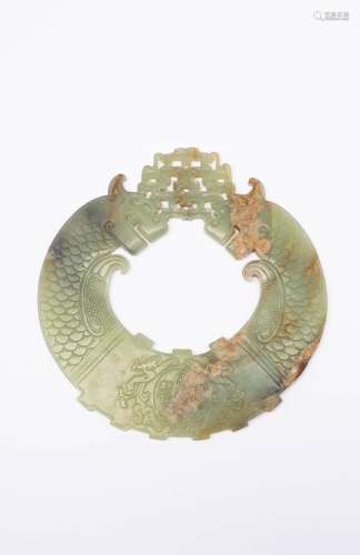A CHINESE CELADON JADE HUAN LATE QING DYNASTY/REPUBLIC PERIO...