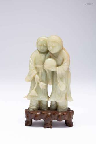 A CHINESE PALE CELADON JADE CARVING OF THE HEHE ERXIAN QING ...
