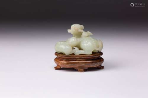 A CHINESE PALE CELADON JADE LION DOG GROUP 19TH CENTURY Carv...