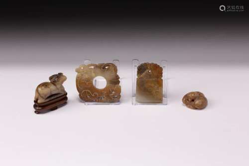 FOUR CHINESE CELADON AND RUSSET JADE ITEMS MING/QING DYNASTY...