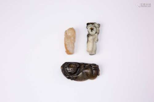 THREE CHINESE JADE CARVINGS OF BOYS QING DYNASTY Each depict...