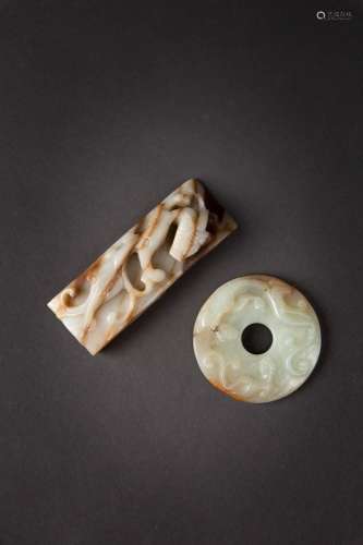 A CHINESE PALE CELADON AND RUSSET JADE BI DISC AND A SCABBAR...