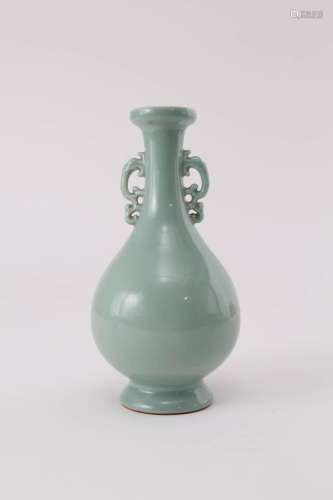A CHINESE CELADON TWIN-HANDLED VASE REPUBLIC PERIOD The pear...