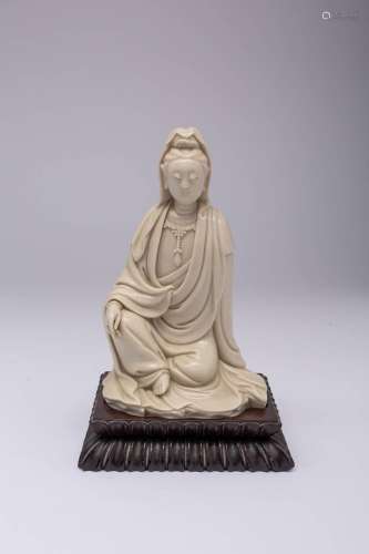 A CHINESE BLANC DE CHINE SEATED FIGURE OF WATER-MOON GUANYIN...