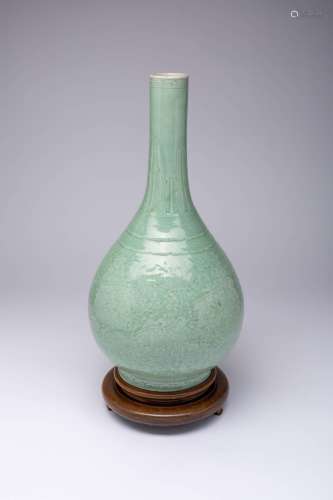 A LARGE CHINESE CARVED CELADON BOTTLE VASE, DANPING 18TH CEN...