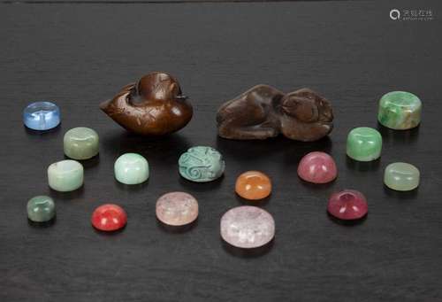 Group of snuff bottle stoppers Chinese including jade, glass...