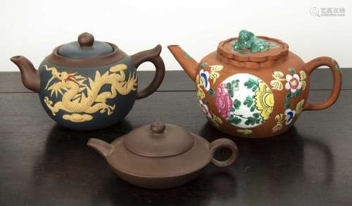 Three yixing teapots Chinese the largest of orange ground de...