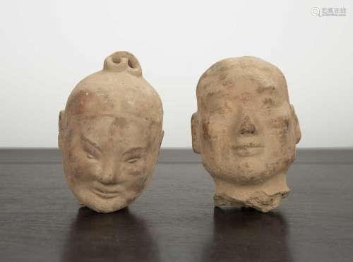 Two clay heads Chinese, Western Han period probably depictin...