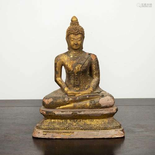 Gilt earthenware buddha Thailand with the hands resting on e...