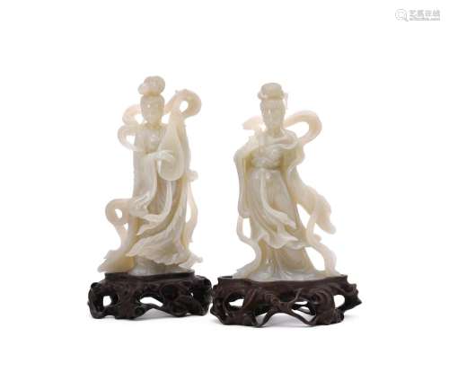 A pair of Chinese celadon jade carvings of ladies