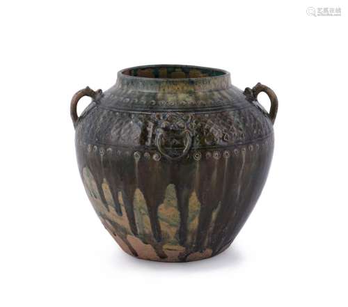 A Chinese twin handled green pottery jar