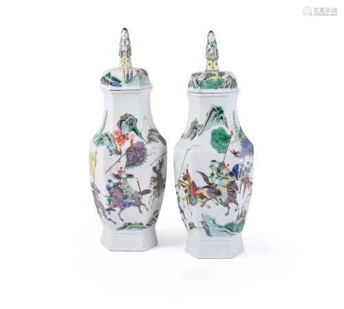 A pair of Chinese famille verte hexagonal vases and covers