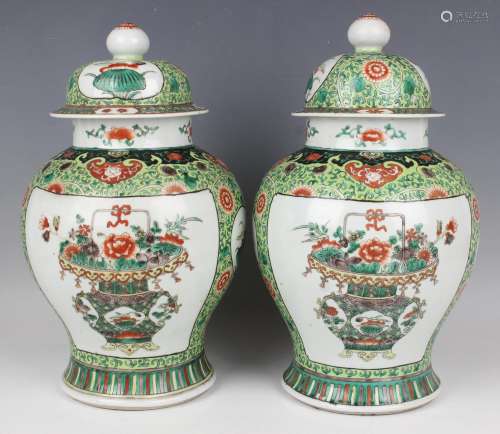A pair of Chinese famille verte porcelain jars and covers