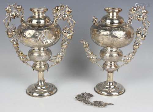 A pair of Chinese silver vases