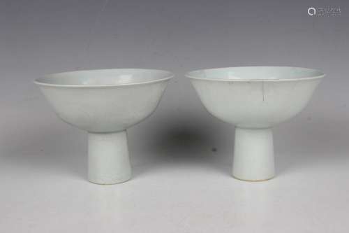 A pair of Chinese white glazed porcelain dragon stem cups
