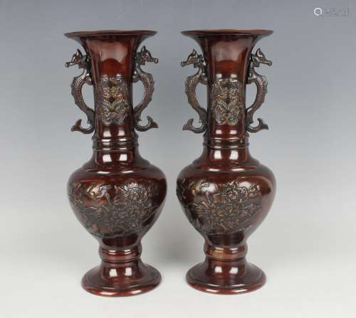 A pair of Japanese brown patinated bronze two-handled vases